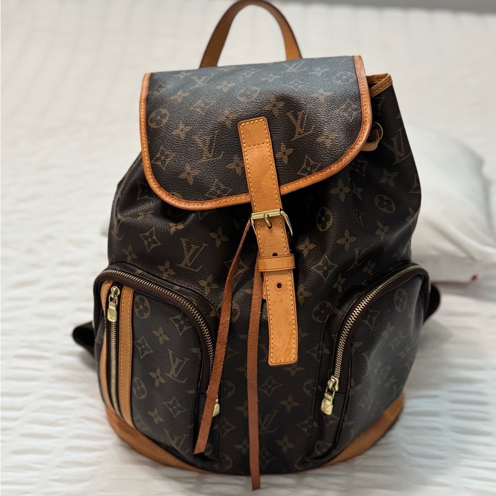 Authentic Louis Vuitton Backpack in excellent condition. Includes dust bag.
